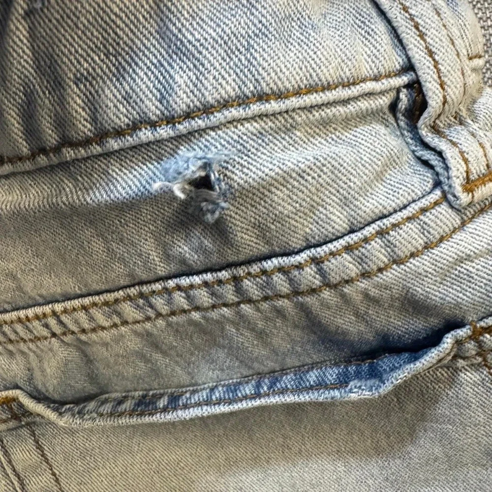 BDG Distressed blue denim shorts with frayed hem